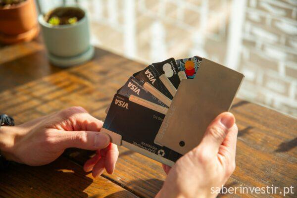 a person holding a credit card in their hand