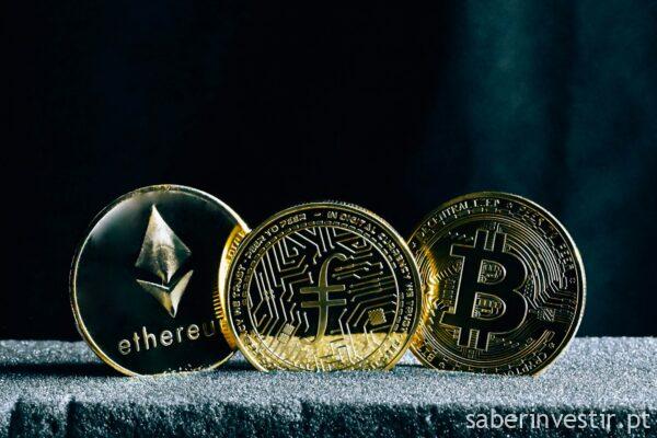 three bitcoins sitting on top of a table