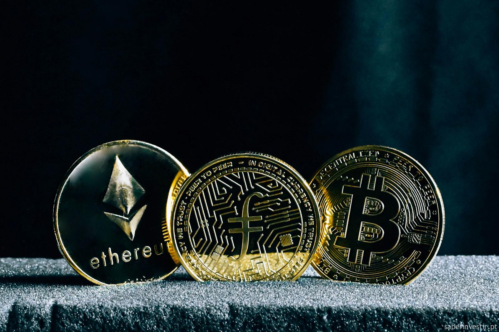 three bitcoins sitting on top of a table